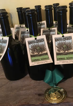 Unopened dark glass bottles of award winning cider from Windfall Orchard in Cornwall Vermont